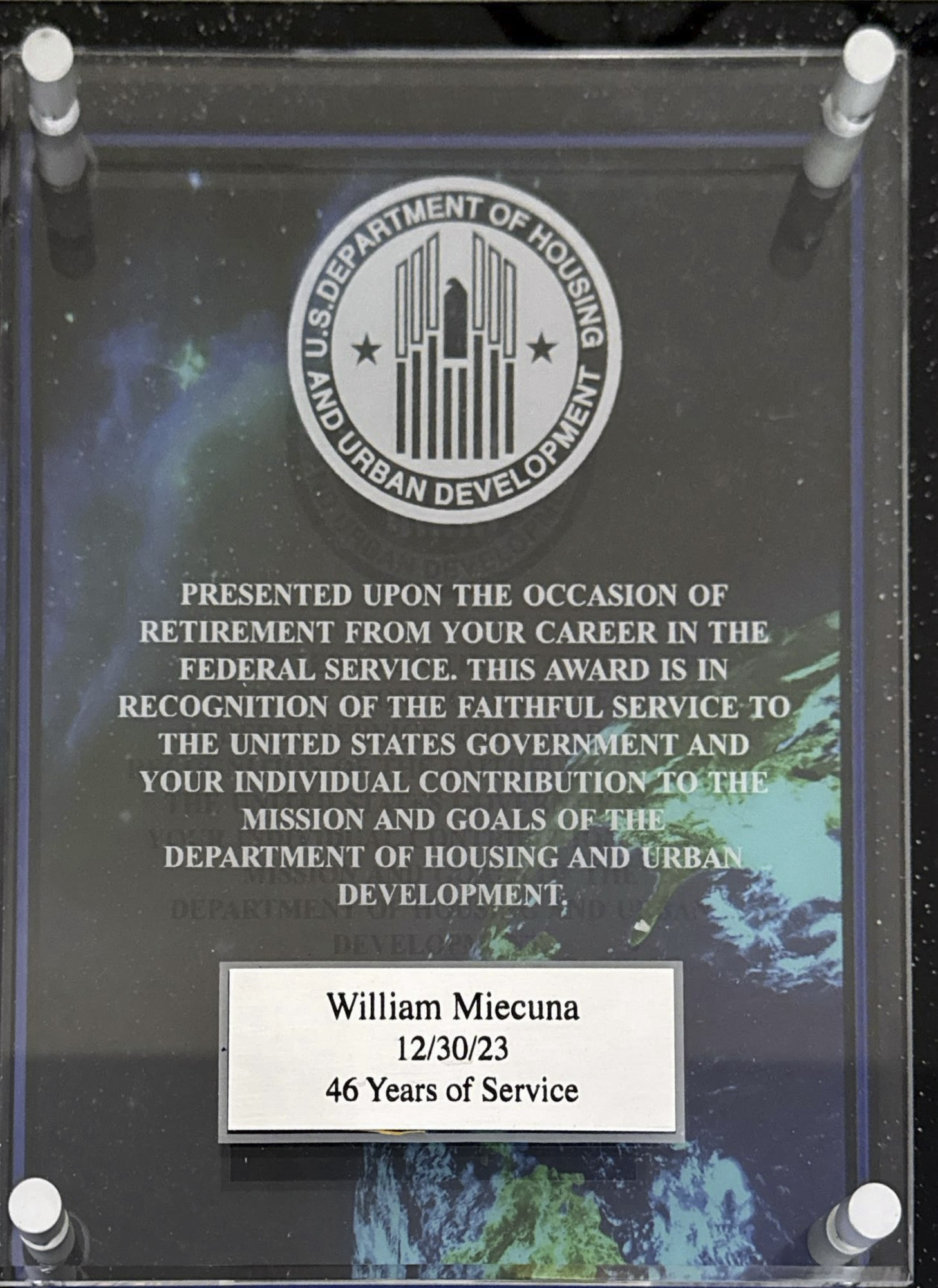 Glass retirement award reading William Miecuna, 12/30/23, 46 Years of Service